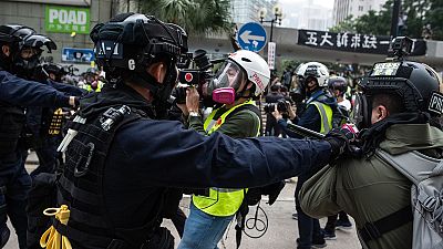 Rally cut short in Hong Kong as police confront protesters