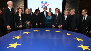 Croatian Prime Minister Andrej Plenkovic (C) with his associates pose for a photograph in Croatia's National and University Library