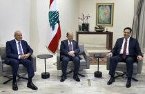 Lebanese President Michel Aoun, center, meets with Prime Minister-Designate Hassan Diab, right,  at the Presidential Palace, Lebanon, Tuesday, Jan. 21, 2020.