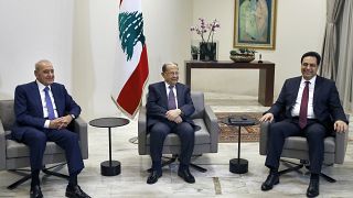 Lebanese President Michel Aoun, center, meets with Prime Minister-Designate Hassan Diab, right,  at the Presidential Palace, Lebanon, Tuesday, Jan. 21, 2020.