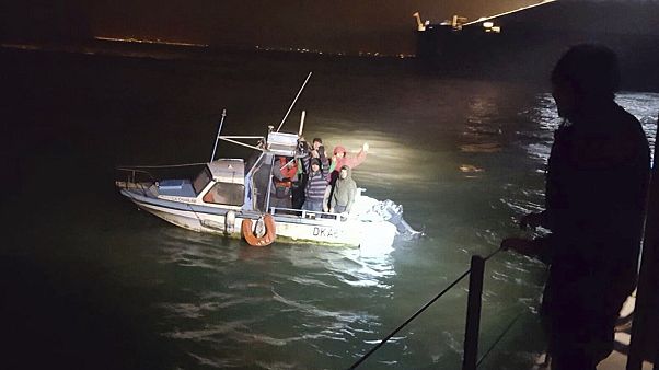 Migrants aboard a boat after being intercepted by French authorities, off the port of Dunkirk, northern France, Tuesday, Nov. 27, 2018. Migrants aboard a boat after being intercepted by French authorities, off the port of Dunkirk, northern France, Tuesday, Nov. 27, 2018.