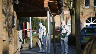German forensic policemen work at a house after a shooter launched an assault on January 24, 2020 in Rot am See in southwestern Germany