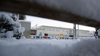 The yard of an elementary school is covered with snow in northern Athens, Tuesday, Jan. 8, 2019