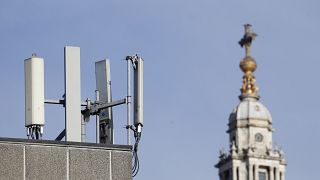 Mobile network phone masts are visible in front of St Paul's Cathedral in the City of London, Tuesday, Jan. 28, 2020