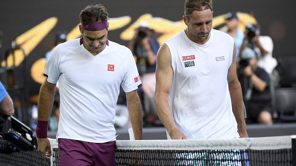 Roger Federer, left, walks with Tennys Sandgrenafter winning their quarterfinal match at the Australian Open tennis championship in Melbourne, Australia Roger Federer, left, walks with Tennys Sandgrenafter winning their quarterfinal match at the Australian Open tennis championship in Melbourne, Australia