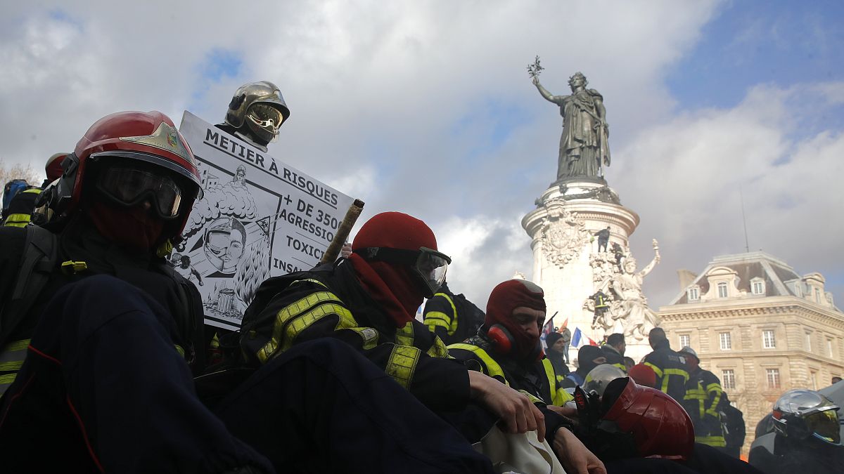 Firefighters gather for a demonstration Tuesday, Jan. 28, 2020 in Paris to demand a better pay and working conditions