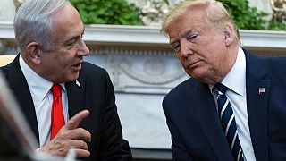 President Donald Trump listens to Israeli Prime Minister Benjamin Netanyahu