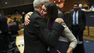 Scottish European Parliament member Aileen McLeod, right, hugs British European Parliament member Richard Corbett.