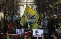Pro-Kurdish people wave flags with the face of jailed PKK leader, Abdullah Ocalan, during a protest demanding his freedom in Brussels in February 2019.