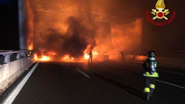 In this photo released by the Italian Firefighters, firemen try to extinguish a dozen vehicles on fire on a highway near Milan, Italy, in the early hours on Jan. 29. In this photo released by the Italian Firefighters, firemen try to extinguish a dozen vehicles on fire on a highway near Milan, Italy, in the early hours on Jan. 29.