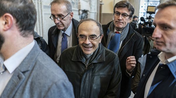 FILE: French Cardinal Philippe Barbarin, center, arrives at the Lyon courtroom for his appeal trial Thursday, Nov.28, 2019 in Lyon, central France. FILE: French Cardinal Philippe Barbarin, center, arrives at the Lyon courtroom for his appeal trial Thursday, Nov.28, 2019 in Lyon, central France.