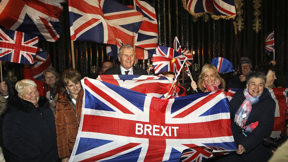 Brexit supporters celebrate during a rally outside Stormont in Belfast, Northern Ireland as Britain left the European Union on Friday, Jan. 31, 2020.