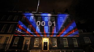 A countdown to Brexit timer and the colors of the British Union flag illuminate the exterior of 10 Downing street, in London, England, Friday, Jan. 31, 2020