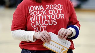 A local resident holds a Presidential Preference Card during an Iowa Democratic Party caucus
