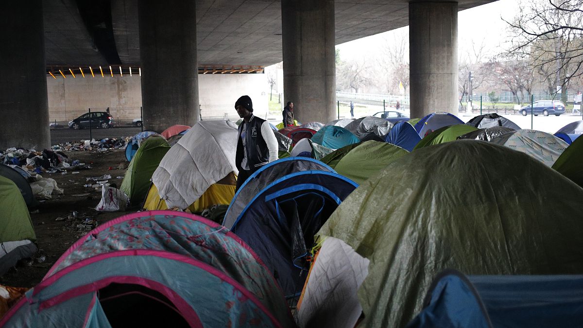 Migrants in a makeshift camp alongside the Porte de la Villette bridge in Paris, in January 2019.