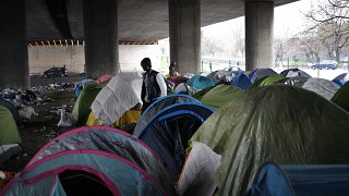 Migrants in a makeshift camp alongside the Porte de la Villette bridge in Paris, in January 2019.