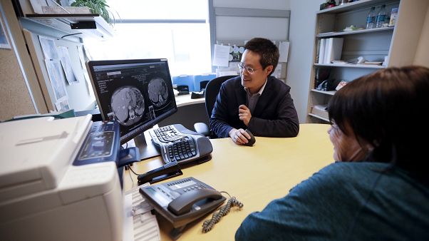 ln this Aug. 15, 2017 photo, a patient looks at images with her doctor Shumei Kato, left, at the University of California San Diego in San Diego. ln this Aug. 15, 2017 photo, a patient looks at images with her doctor Shumei Kato, left, at the University of California San Diego in San Diego.
