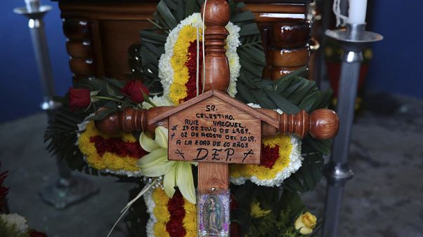 A cross bearing the name of Mexican journalist Jorge Celestino Ruiz Vazquez is displayed near the coffin containing his remains in Actopan, Veracruz, Saturday, Aug. 3, 2019 A cross bearing the name of Mexican journalist Jorge Celestino Ruiz Vazquez is displayed near the coffin containing his remains in Actopan, Veracruz, Saturday, Aug. 3, 2019