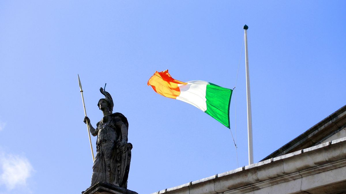The Irish flag flouts the wind as it flies at half staff over the General Post Office on O'Connell street, Dublin, Ireland, Sunday, March, 27, 2016.
