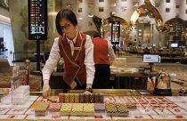 FILE PHOTO : A croupier works at a gaming table at MGM Cotal Rescort in Macau Tuesday, Feb.13, 2018.