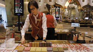 FILE PHOTO : A croupier works at a gaming table at MGM Cotal Rescort in Macau Tuesday, Feb.13, 2018.