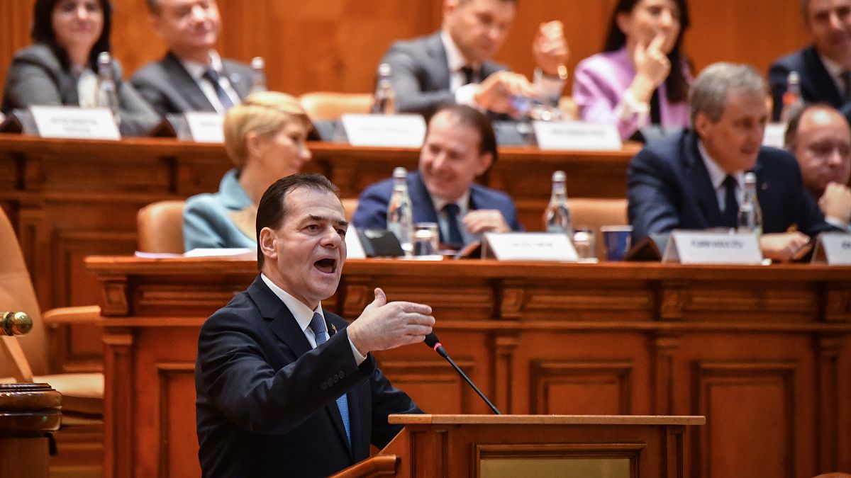 Romanian Prime Minister Ludovic Orban delivers his speech during a no-confidence vote at the Romanian Parliament in Bucharest on February 5, 2020.
