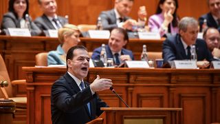 Romanian Prime Minister Ludovic Orban delivers his speech during a no-confidence vote at the Romanian Parliament in Bucharest on February 5, 2020.