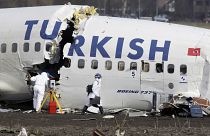 Crash investigators examine the wreckage of the Turkish airlines plane at Amsterdam's Schiphol Airport, Thursday, Feb. 26, 2009.