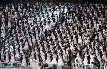 Couples attend a mass wedding ceremony organised by the Unification Church at Cheongshim Peace World Center in Gapyeong on February 7, 2020