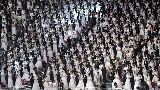 Couples attend a mass wedding ceremony organised by the Unification Church at Cheongshim Peace World Center in Gapyeong on February 7, 2020