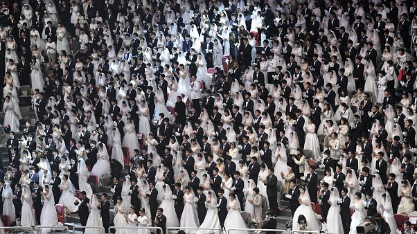 Couples attend a mass wedding ceremony organised by the Unification Church at Cheongshim Peace World Center in Gapyeong on February 7, 2020 Couples attend a mass wedding ceremony organised by the Unification Church at Cheongshim Peace World Center in Gapyeong on February 7, 2020