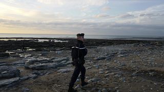 French gendarme patrols the beach in Ambleteuse near Calais, northern France.