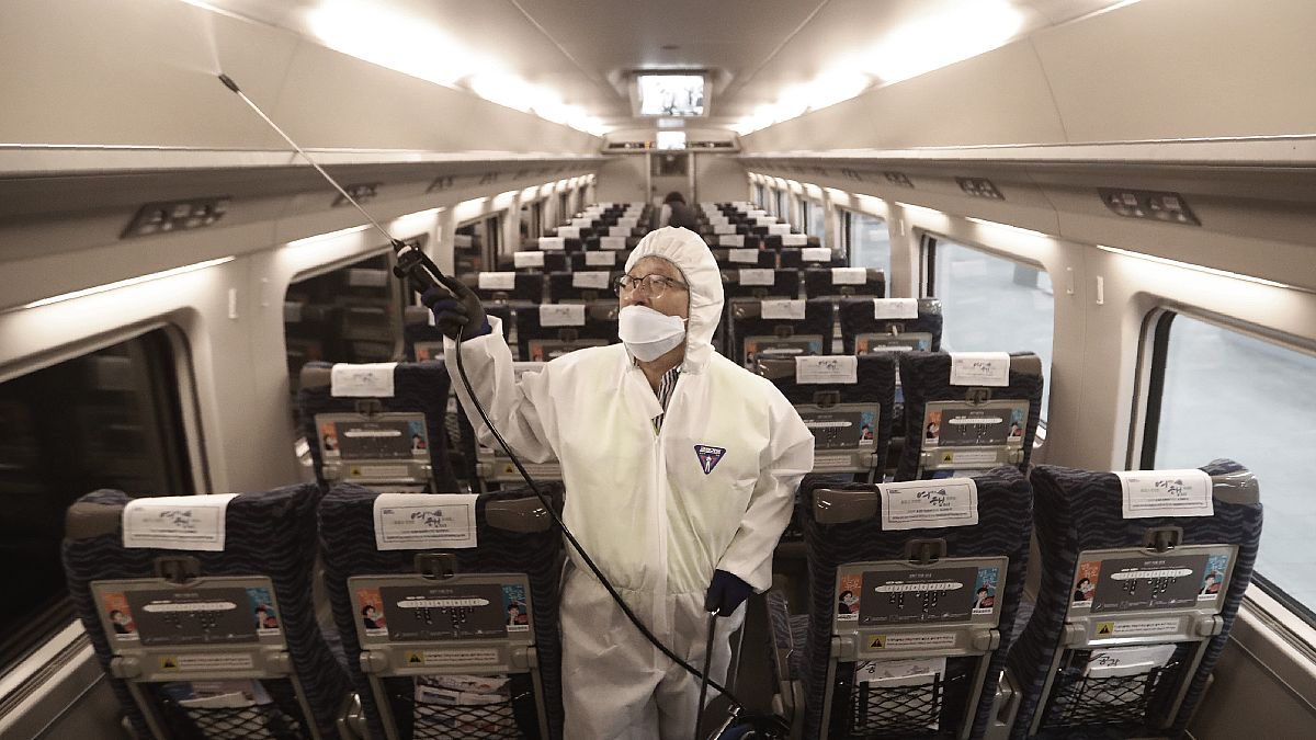 (January 24, 2020) , A train officer sprays disinfectant as a precaution against coronavirus contamination at Suseo Station in Seoul, South Korea.