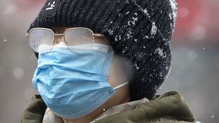 Une femme porte un masque à Pékin, le 3 février 2020 / Chine