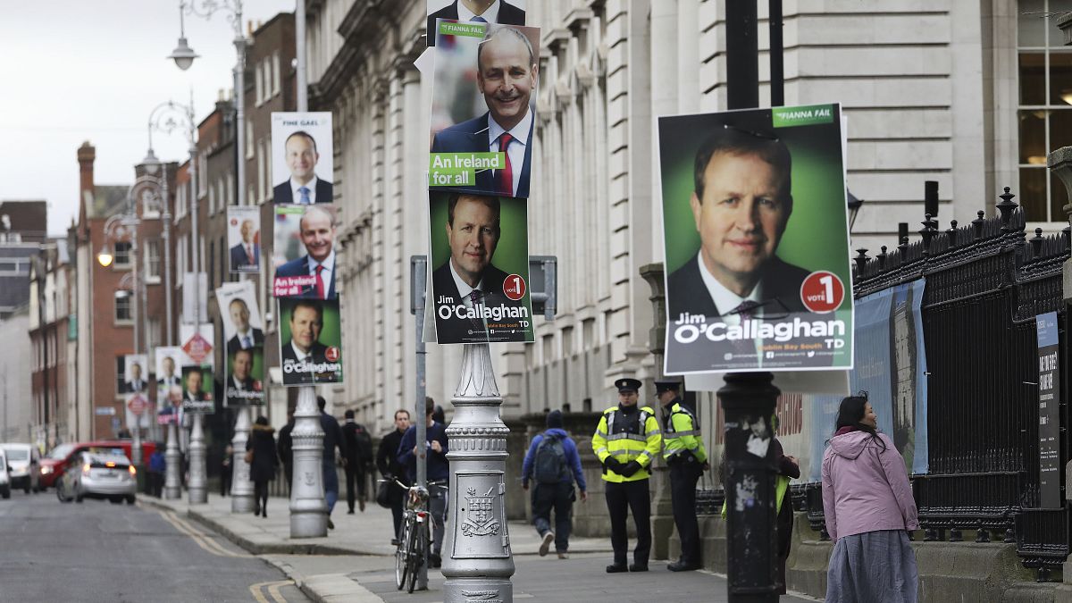 Election posters are displayed on lampposts outside the Irish Prime Minister offices in Dublin, Ireland, Friday, Feb. 7, 2020. 