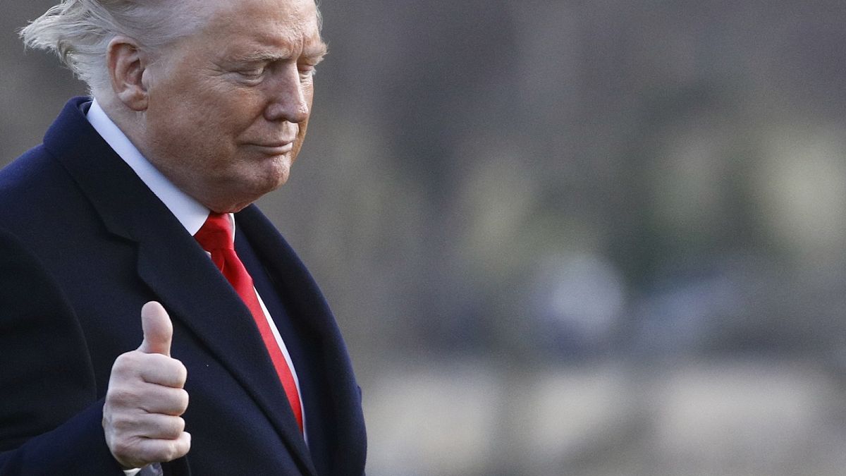 President Donald Trump gestures as he walks to the Oval Office of the White House in Washington, Friday, Feb. 7, 2020, after stepping off Marine One