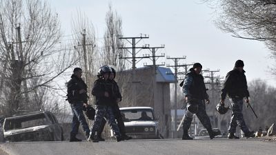 (February 8, 2020) Riot police guard the streets in the village of Masanchi, Kazakhstan.