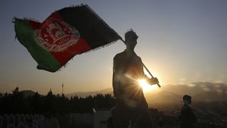 (August 19, 2019) A man waves an Afghan flag during Independence Day celebrations in Kabul, Afghanistan