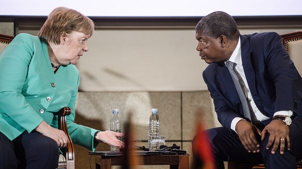 German Chancellor Angela Merkel (L) and Angola's President Joao Lourenco talk during a contract signing ceremony at the German-Angolan economy forum in Luanda German Chancellor Angela Merkel (L) and Angola's President Joao Lourenco talk during a contract signing ceremony at the German-Angolan economy forum in Luanda