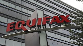 FILE- This July 21, 2012, file photo shows signage at the corporate headquarters of Equifax Inc. in Atlanta.