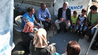 UN high commissioner for refugees Filippo Grandi speaks with Syrian refugees
