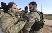 Turkish backed fighter prepare to go to the frontline in the Syrian province of Idlib, Monday, Feb. 10, 2020.