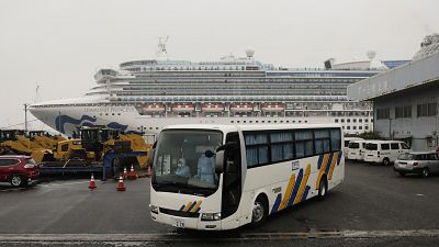 A bus believed to be carrying passengers from the quarantined Diamond Princess