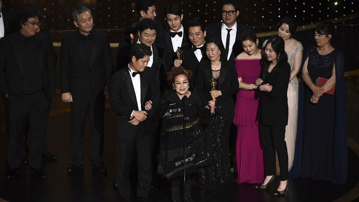 The cast and crew of "Parasite" accept the award for best picture at the Oscars on Sunday, Feb. 9, 2020, at the Dolby Theatre in Los Angeles