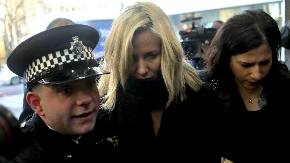 Love Island TV presenter Caroline Flack, centre, escorted by police, as she arrives at Highbury Magistrates' Court in London, Monday, Dec. 23, 2019. 