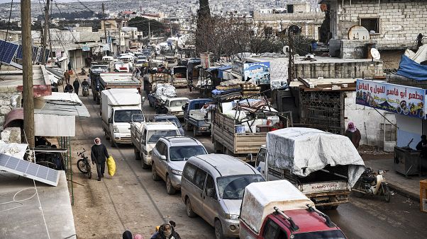Civilians flee from Idlib toward the north to find safety inside Syria near the border with Turkey, Saturday, Feb. 15, 2020. Civilians flee from Idlib toward the north to find safety inside Syria near the border with Turkey, Saturday, Feb. 15, 2020.