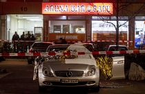 A car in front of one the two bars attacked in Hanau, Germany Thursday, Feb. 20, 2020. (AP Photo/Michael Probst)