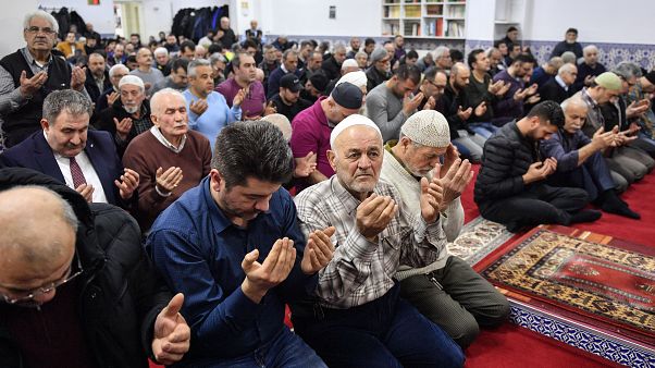 Muslim believers pray in a mosque for the victims of the shooting in Hanau, Germany, Friday, Feb. 21, 2020. Muslim believers pray in a mosque for the victims of the shooting in Hanau, Germany, Friday, Feb. 21, 2020.