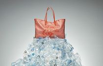 The tote bag uses a total of 32 bottles.