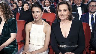 Berlin: 70th Berlinale, opening gala: Actress Margaret Qualley and actress Sigourney Weaver at the opening ceremony of the International Film Festival.